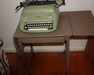 Vintage green royal typewriter & typewriter metal table w/drawer and wheels 