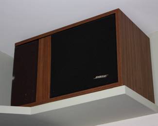 Pair Bose speakers in wood cabinet