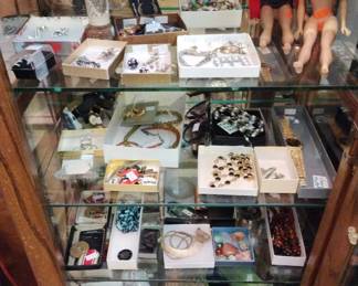 Jewelry in four showcases, plus all types of small collectibles