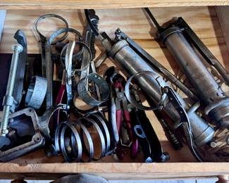 Grease guns and oil filter wrenches