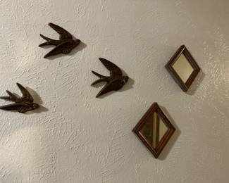 2 mirrors look like windows that the birds are going to fly out of.