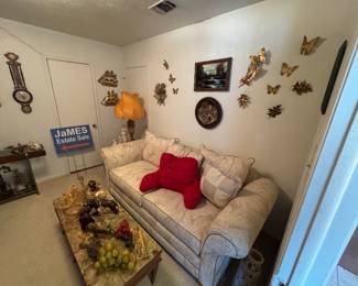 Brass butterflies, vintage marble topped end tables and coffee table