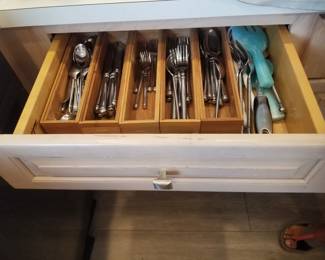 Kitchen cabinetry: Designer by Medallion. Flatware