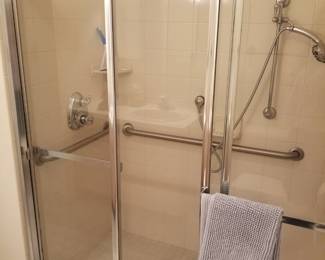Handicap access shower enclosure opens to allow wheelchair entry
