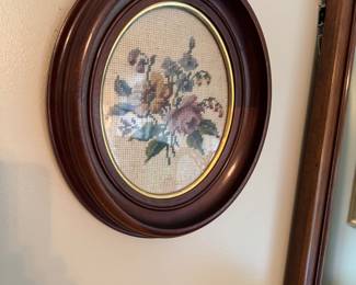 One of a pair of needlepoint in antique frames