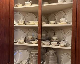 Antique blind corner cupboard with the Lenox china service