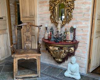 Foyer.  Scholars chair, wooden saints