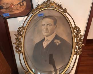 Antique photo in antique convex brass frame