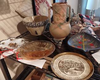 Variety of collectible plates and pottery