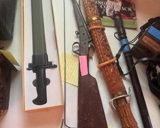 Stevens 22 long rifle 
Vintage gun 
Hand carved sord made in Cambodia in early 1950’s 