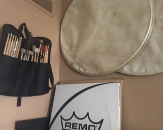 Bag of sticks and drum heads 