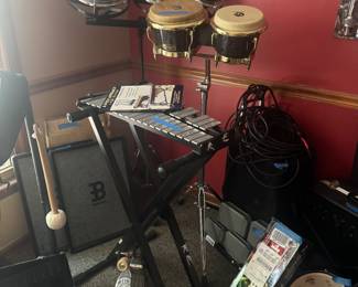 Galaxy drums w stand, xylophone with stands, new in box Bells, another drum, multi stand metal and parts, sound PA system 
Large 3 head drum percussion 