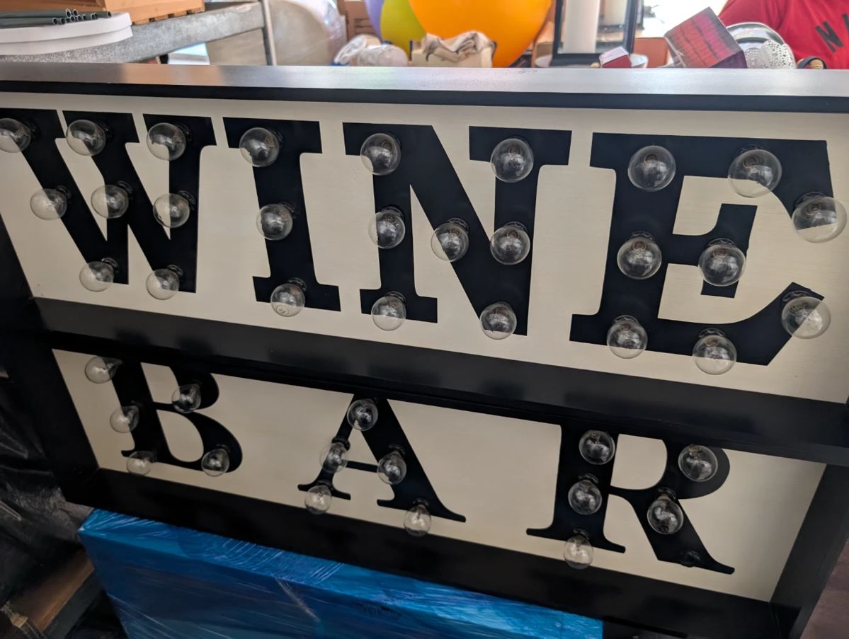 This is a two piece sign that has lights