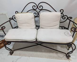Metal bench with cushions
