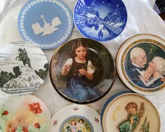 Collectible plates, each visible is part of a stack