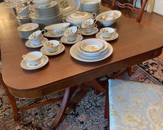 Federal mahogany double pedestal dining table and a set of 6 Chippendale dining chairs 