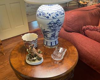 One of a pair oriental lamps with round walnut end table 
