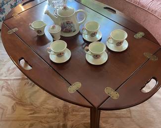 Mahogany butler’s tray coffee table with Danbury Mint Shirley Temple tea set
