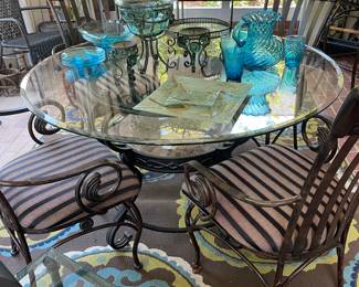 Iron and glass topped table and 4 chairs 