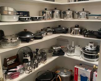 Pantry of cookware and kitchen items and appliances 