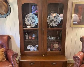 Walnut Victorian bookcase with blue and while chargers and accessories 