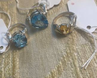 Group of blue topaz and citrine and sterling rings