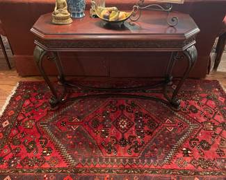 Iron and mahogany sofa table with 5’x4’ oriental rug