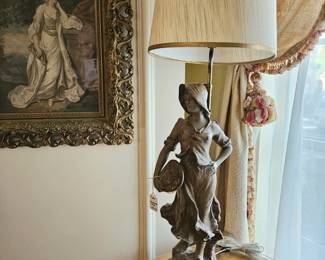 1920s figural lamp of a woman walking to market