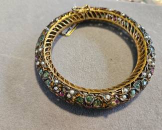 Mogul bangel with mine cut commercial grade emeralds, rubies, seed pearls on gold washed metal.