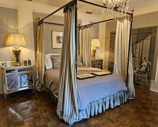 Black iron four poster bed, 20th century. Pair of mirrored side tables, 20th century