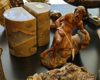 An Allegorical figure in terra cotta, onyx bookends (one of several sets), marble and various hardstone spheres, mineral and geod specimens.