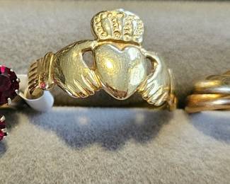 Garnets, 14k Claddagh ring, and Tiffany tricolor 18k gold band.