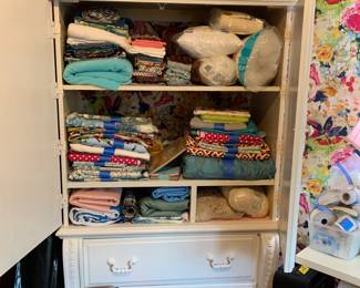 Crafters dream room! Material, ribbon, sewing machines... you name it, it is probably here waiting for you.