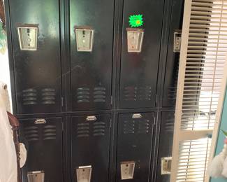 Eight metal attached lockers. Perfect for a boys room, garage, craft room, or dog lovers storage.