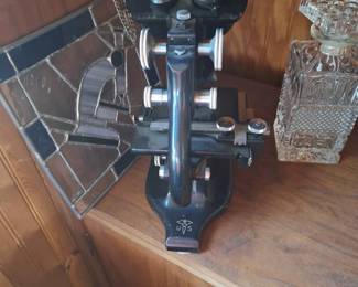 the back of the microscope.