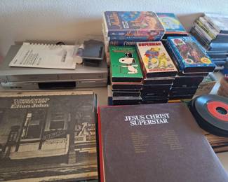 vintage VHS tapes, albums, VHS player