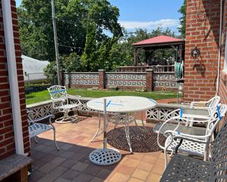 OUTOOR CAST IRON TABLE, CHAIRS, BENCH AND UNBRELLA STAND. DISGREGARD BLUE TAPE!