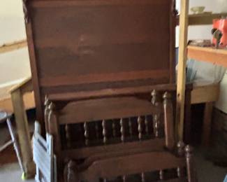 Several beds including antique oak headboard.
