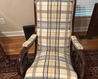 Nicely upholstered vintage rocking chair.