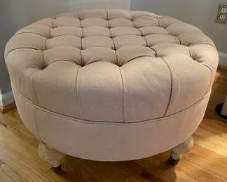 Tufted Beige Ottoman with Wooden Legs on Wheels