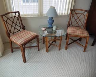 Rattan dining chairs; glass top rattan accent table