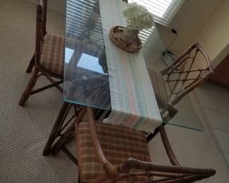 Glass top dining table seats 6 - includes 6 rattan chairs