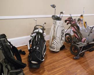 golf clubs, bags, practice putt,