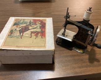 small child's German sewing machine with box