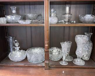 There are lots of vintage cut glass pieces, many are Hawkes glass