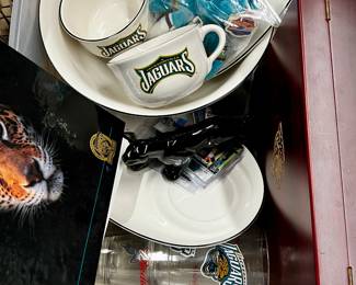 Lot of Jacksonville Jaguars China, pint glasses, cookbook, trading cards, jewelry box
