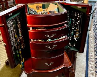 Jewelry armoire filled with fashion jewelry