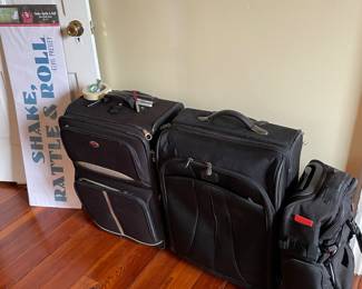 Three pieces of rolling luggage