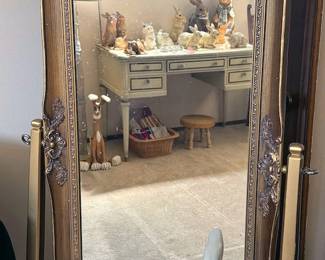 Rabbit with gold-framed standing mirror
