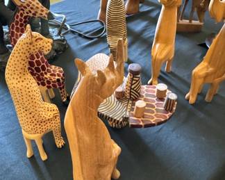 Assorted animal statues, mostly wooden